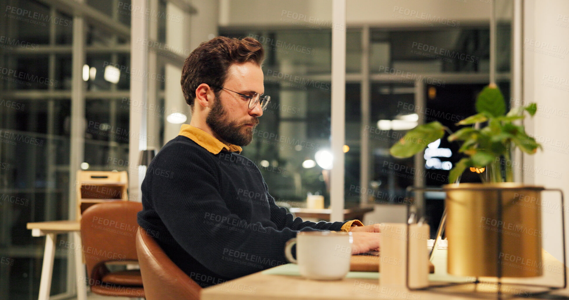 Buy stock photo Man, laptop and night at startup, project and research for report, typing and deadline in office. Person, editor and computer with click, feedback or review process with overtime at creative agency