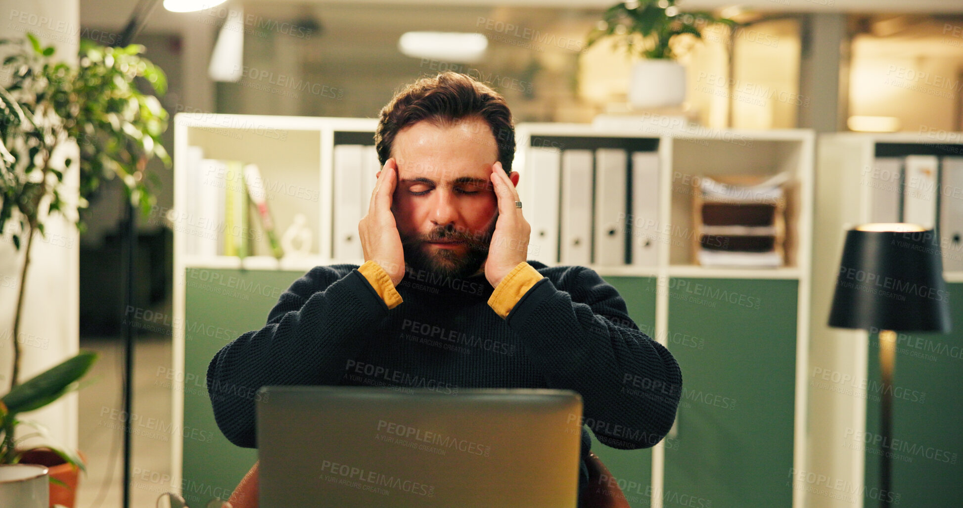 Buy stock photo Night, stress and business man with headache, exhausted and overworked accountant in office. Tired, burnout and worker with migraine on deadline, pressure or auditor with fatigue for tax on laptop