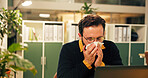 Sick man, night and blowing nose with tissue at office for influenza, virus or viral infection. Male person, employee or administrator with sneeze for sinus allergy, hayfever or illness at workplace