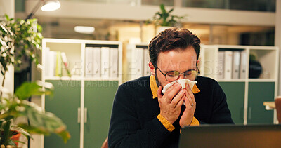 Buy stock photo Sick man, night and blowing nose with tissue at office for influenza, virus or viral infection. Male person, employee or administrator with sneeze for sinus allergy, hayfever or illness at workplace
