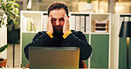 Man, laptop and headache at startup, stress or exhausted with burnout for deadline at night. Person, editor and migraine with pc, pain or frustrated for project, vertigo or fatigue at creative agency