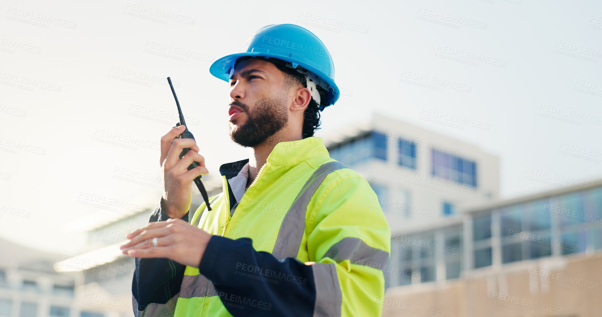 Buy stock photo Man, engineer and explain on radio outdoor for discussion, planning and construction feedback. Male person, conversation and tech for architecture, building instructions and advice as project manager
