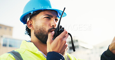 Buy stock photo Construction site, radio and man with engineering, talking and inspection with conversation. Helmet, outdoor and person with architecture, project management and property renovation with safety check