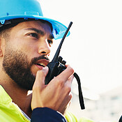 Inspection, radio and man with engineering, feedback and property ...