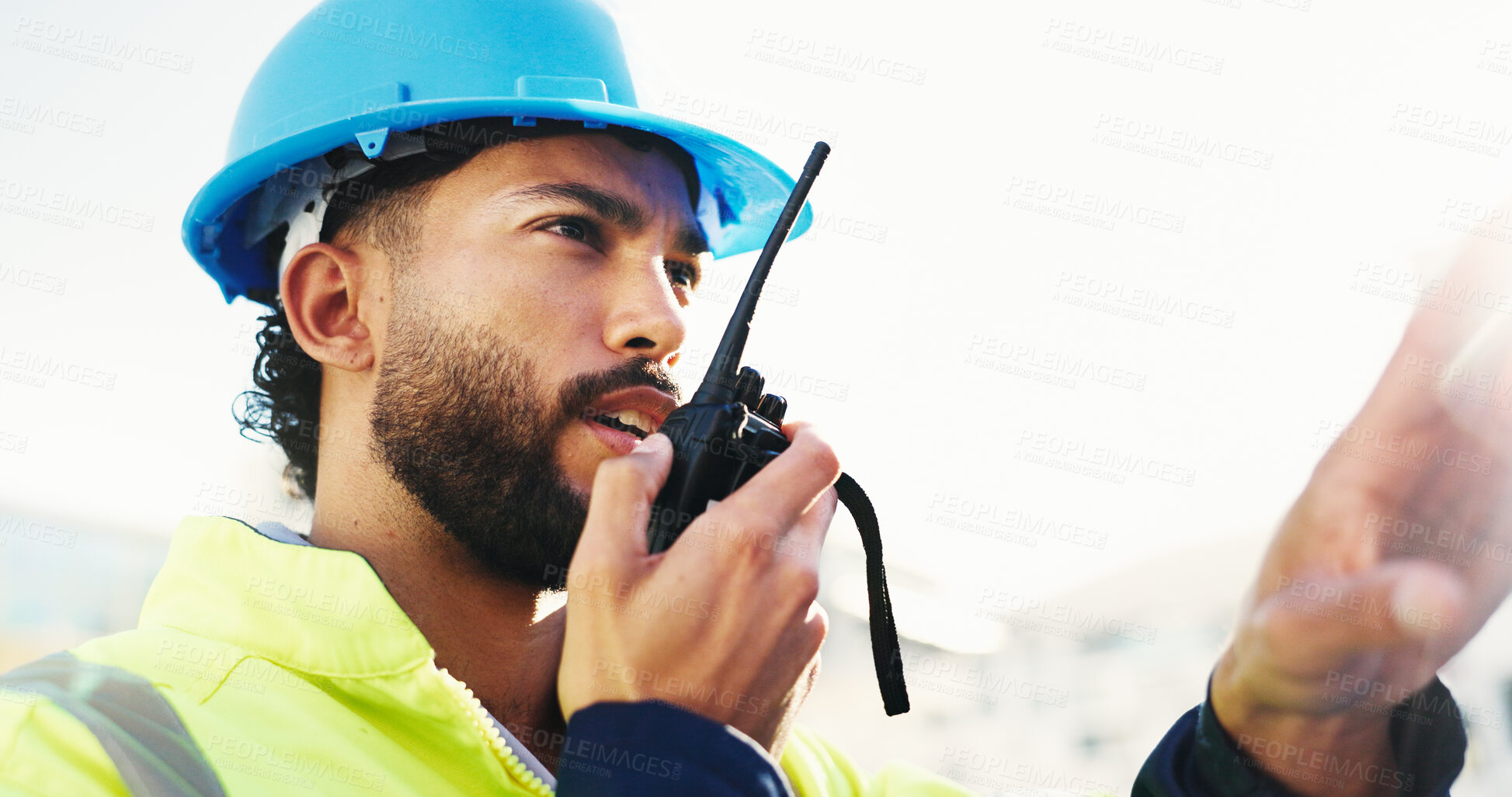 Buy stock photo Inspection, radio and man with engineering, feedback and property renovation with quality control. Helmet, outdoor and person with architecture, conversation and project management with safety check