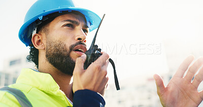 Buy stock photo Construction site, radio and man with engineering, conversation and inspection with quality control. Helmet, risk assessment and person with technology, schedule and property renovation with advice