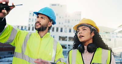 Buy stock photo Construction site, engineering and man with woman, inspection or conversation with feedback. People, outdoor or employees with safety check, risk assessment or project management with quality control