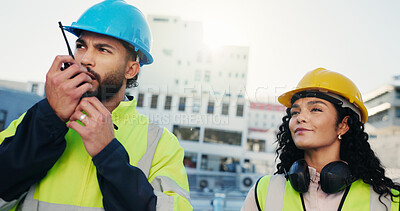 Buy stock photo Construction site, team and radio for communication with people outdoor in city for management. Man, woman and engineering with manager speaking for building maintenance, project or architecture