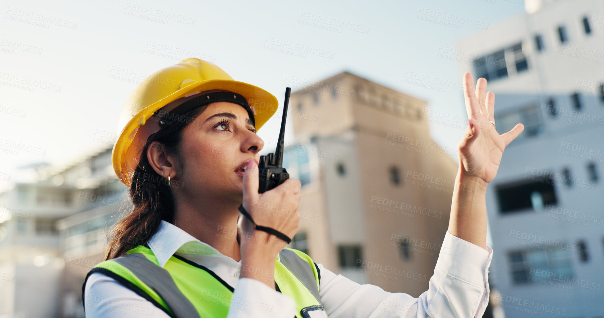 Buy stock photo Woman, engineer and explain on radio outdoor for discussion, planning and construction advice. Person, equipment and talking for architecture, building instructions or feedback for project management