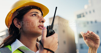 Buy stock photo Woman, construction site and radio for planning, communication and inspector outdoor in city. Engineer, update and manager speaking for building maintenance, project instruction or architecture