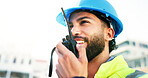 Construction site, radio and man with feedback, architecture and inspection with quality control. Helmet, outdoor and person with engineering, conversation and property renovation with instructions