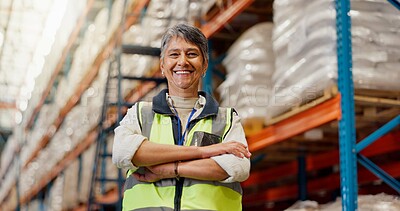 Buy stock photo Woman, arms crossed and happy at warehouse for logistics, pride or low angle for supply chain management. Mature person, smile and engineer with shipping job, freight or portrait at plant in Colombia
