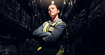 Portrait, night and woman with arms crossed, distribution and manufacturing with confidence. Logistics, person or inspector with vest, evening or expert with shipping, career ambition or supply chain