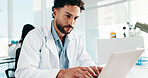 Man, scientist and reading on laptop in lab for research, study results and medical experiment. Male person, typing and online for project, biotechnology and science article of healthcare information