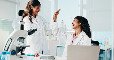 Buy stock photo Science, women or high five with laptop in lab for research breakthrough, medical success or goals. Scientists, teamwork and celebration for vaccine development, cancer immunotherapy and innovation