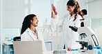 Scientist, women or high five with laptop in lab for clinical trial success, study results or goals. Science, teamwork and celebration for medical research and breakthrough for cancer immunotherapy