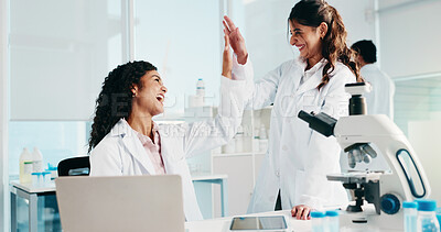 Buy stock photo Scientist, women or high five with laptop in lab for clinical trial success, study results or goals. Science, teamwork and celebration for medical research and breakthrough for cancer immunotherapy