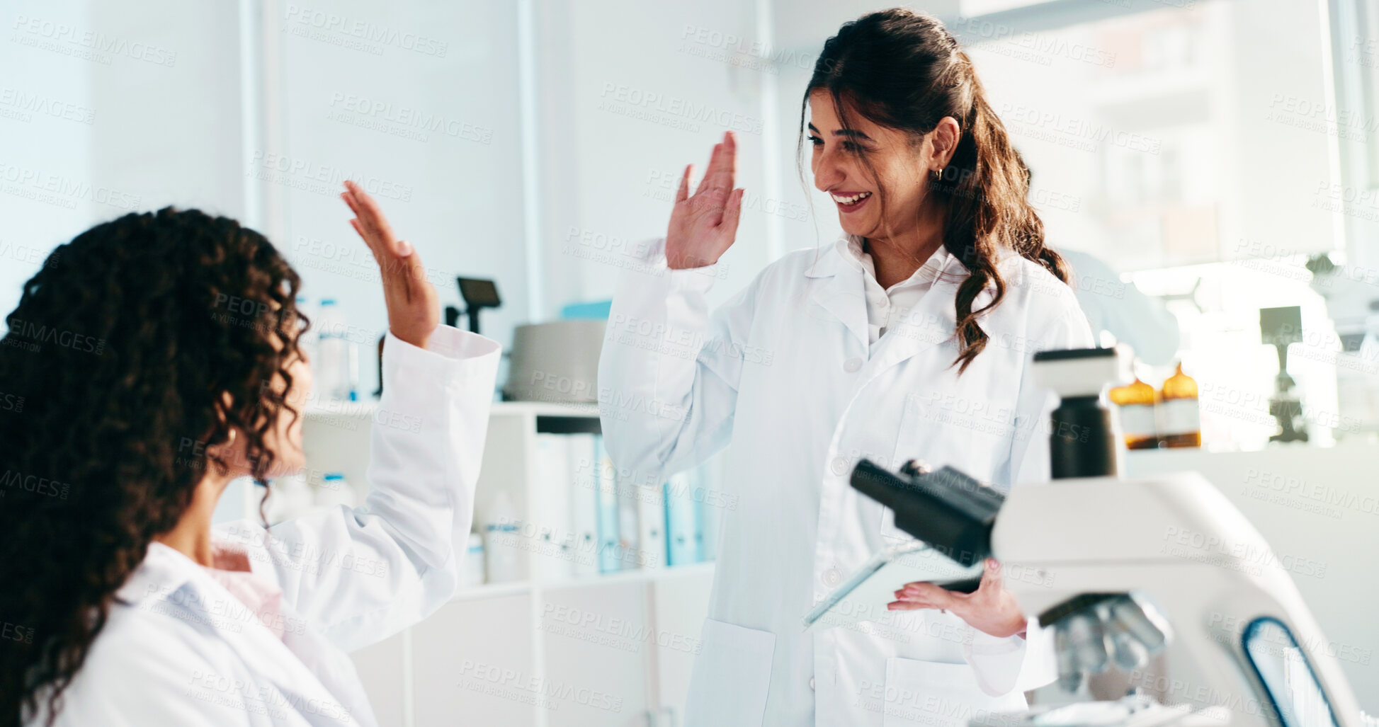 Buy stock photo Scientist, women and high five with tablet in lab for experiment success, research results or goals. Science, teamwork and celebration for medical innovation and breakthrough for cancer immunotherapy