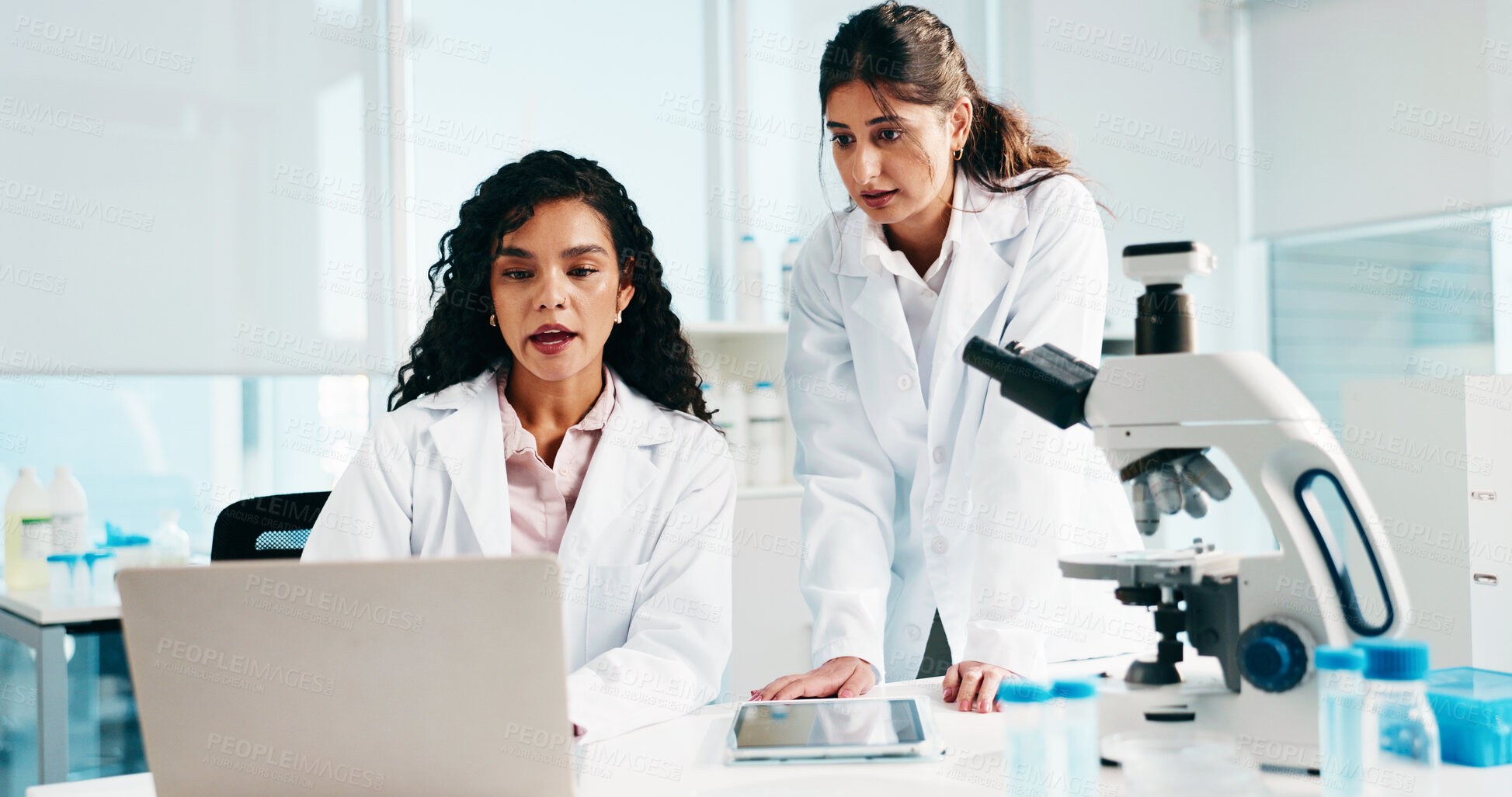 Buy stock photo Woman, scientist and team with laptop, discussion and review for medical research at laboratory. People, computer and feedback for pharmaceutical project with insight, innovation or breakthrough