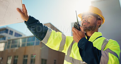 Buy stock photo Engineer, radio and inspection with man on rooftop for property blueprint, architect or feedback. Low angle, communication and building contractor with person on construction site for progress report