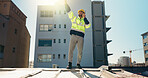 Engineer, radio and planning with man on rooftop for property developer, architecture and feedback. Inspection, renovation and building contractor with person on construction site for progress report