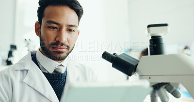 Buy stock photo Science, tablet and man with microscope in lab for medical research, medicine study and online results. Healthcare, biology and scientist on digital tech for vaccine report, innovation and experiment