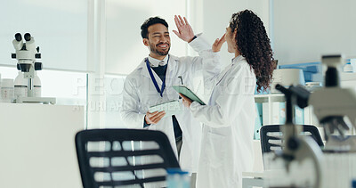Buy stock photo Science, people or high five with tablet in lab for clinical trial success, test results and goals. Scientist, teamwork or celebration for medical research, breakthrough or cancer immunotherapy study