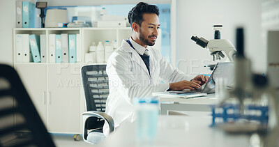Buy stock photo Science, laptop and man typing in lab for medical research, medicine study and results. Healthcare, microscope and scientist on digital tech for vaccine report, innovation and biology experiment