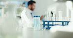 Science, sample and scientist with test tube in lab for study, medical research and medicine development. Healthcare, pharmaceutical and man with equipment for analysis, biology and experiment