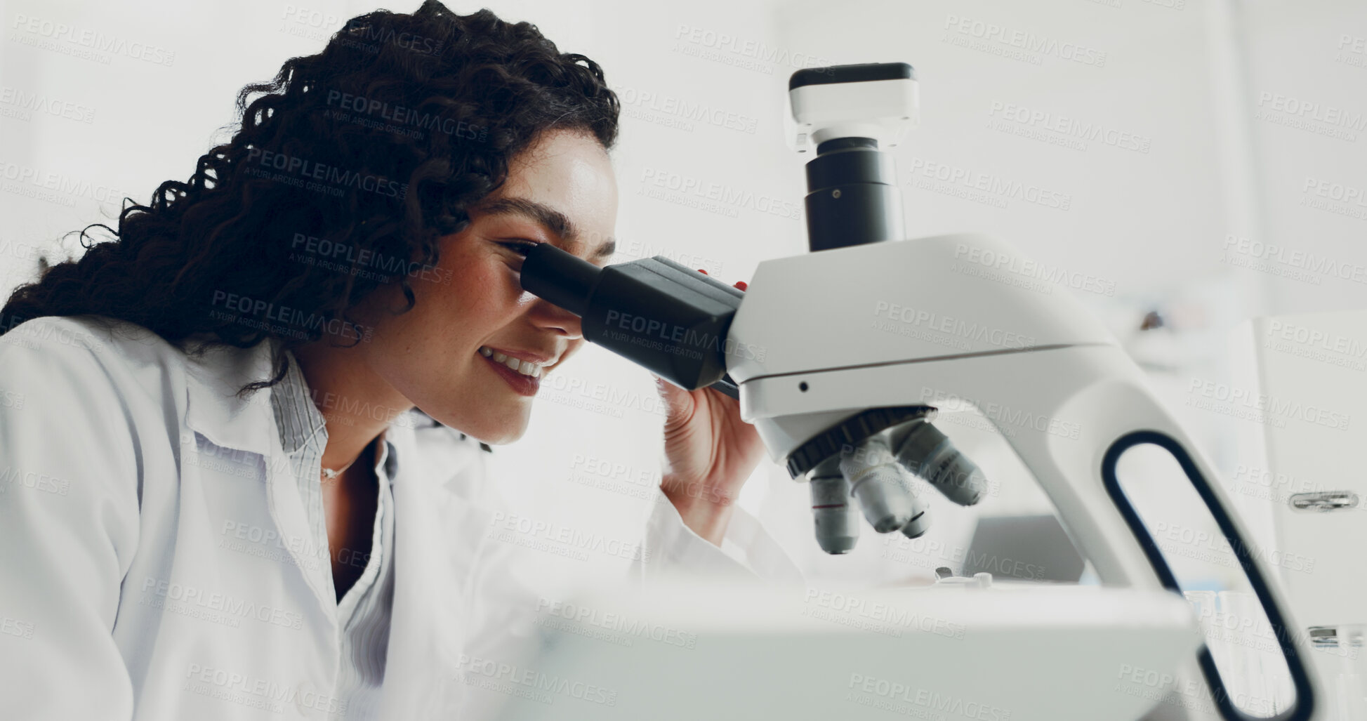 Buy stock photo Scientist, woman and study with microscope in lab for medical innovation, DNA solution or test. Science, person and happy with microbiology equipment for cancer research, cure development or analysis