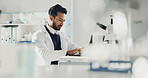 Man, laptop and scientist typing in laboratory for research report, medical review or online analysis. Science, male doctor and computer for writing evaluation, forensic study and innovation tech
