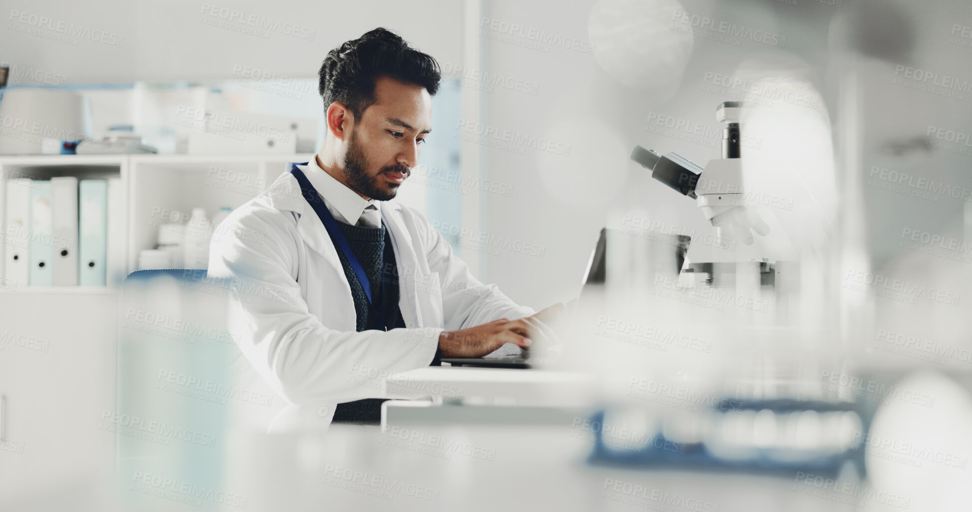 Buy stock photo Man, laptop and scientist typing in laboratory for research report, medical review or online analysis. Science, male doctor and computer for writing evaluation, forensic study and innovation tech