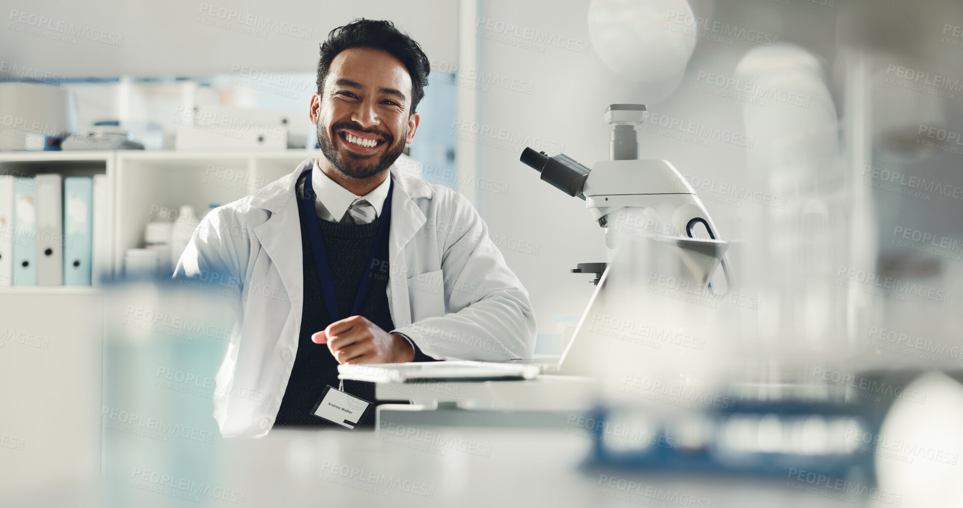 Buy stock photo Portrait, science and man with smile, research and confidence with microscope. Happy person, scientist and employee in medical laboratory, studying results and experiment for vaccine development
