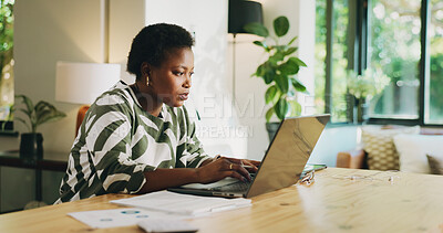 Buy stock photo Serious, black woman and typing on laptop at house for accounting, finance report and review budget. Female person, audit and tech with financial results, statistics document and expenses information