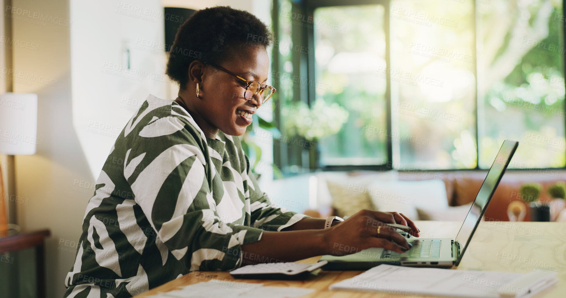 Buy stock photo Typing, woman and bookkeeping with laptop, home or review of financial report, happy or remote work. Freelancer, smile and black person with tech for research, read and info for spreadsheets in house