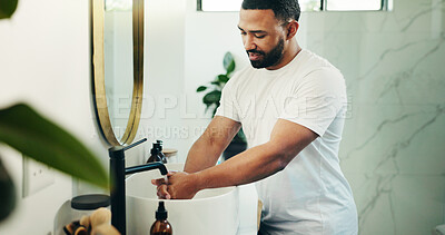 Buy stock photo Bathroom, man and washing hands with water for hygiene, germ prevention and cleaning skin. Tap, rinse and person in home for disinfection, bacteria and virus removal for health with morning routine