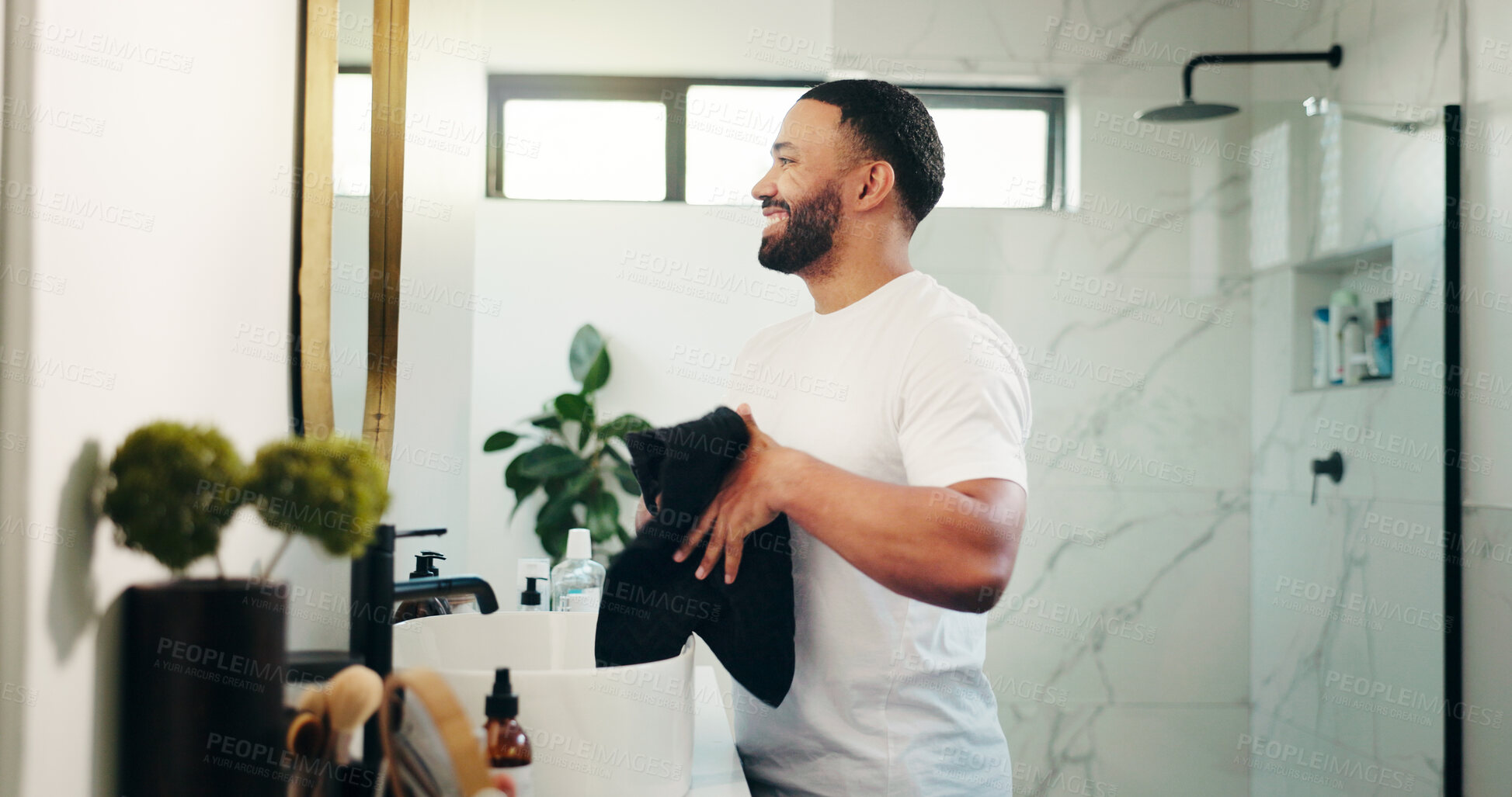 Buy stock photo Mirror, beauty and towel with man in bathroom for skincare, grooming and cosmetics. Morning routine, dermatology progress and facial benefits with person in home for glow, treatment and hydration