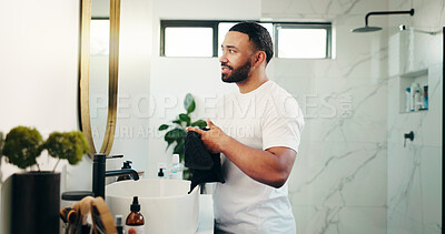 Buy stock photo Mirror, beauty and check with man in bathroom for skincare, grooming and cosmetics. Morning routine, dermatology progress and facial benefits with person in home for glow, treatment and hydration