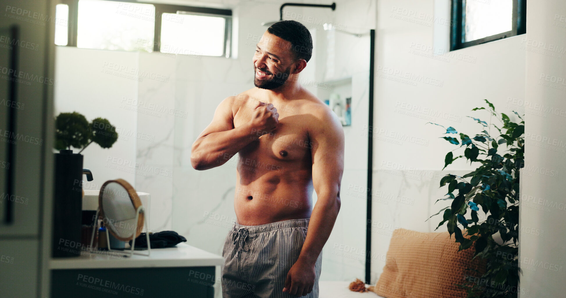 Buy stock photo Bathroom, man and flex muscles in mirror for fitness progress, biceps growth and workout pride. Person, happy bodybuilder and strong arms in home with grooming routine, getting ready and body goals