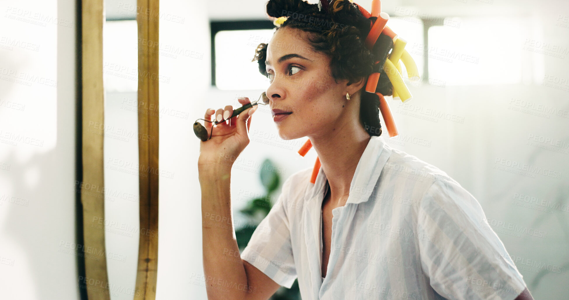 Buy stock photo Bathroom, skincare or girl with jade roller in mirror for grooming, lymphatic drainage or routine. Haircare, woman or cosmetic tool in home for self care, beauty treatment or getting ready in morning