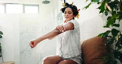 Buy stock photo Skincare, bathroom and woman apply body cream for self care, wellness and sunscreen for hydration. Home, cosmetics and happy person with lotion on arm for beauty, dermatology and collagen moisturizer