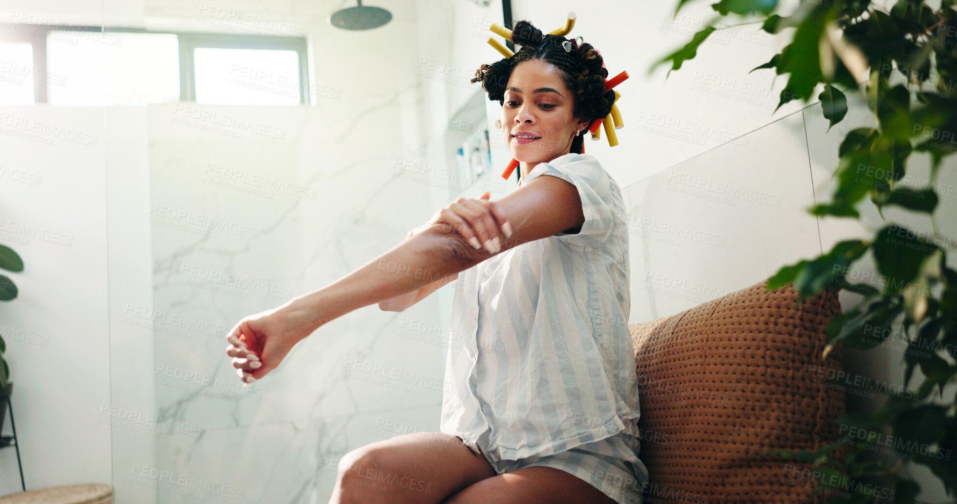 Buy stock photo Skincare, bathroom and woman apply body cream for self care, wellness and sunscreen for hydration. Home, cosmetics and happy person with lotion on arm for beauty, dermatology and collagen moisturizer