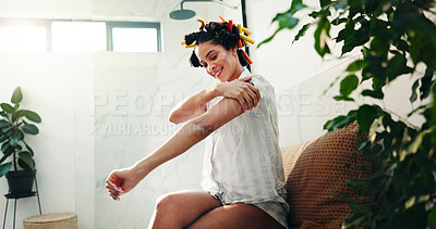 Buy stock photo Skincare, beauty and woman apply lotion for morning routine, shine or sunscreen for hydration. Home, cosmetics or happy girl with body cream on arm for dermatology or collagen moisturizer in bathroom