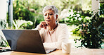Thinking, freelancer and mature woman with laptop for reading, planning lesson or course idea. Remote work, computer or problem solving with thoughts in home backyard for education with serious tutor
