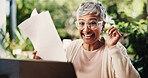 Paper, celebration and old woman on laptop for financial success, mortgage approval or profit. Document, excited and person winning with retirement savings, debt free and investment at home backyard