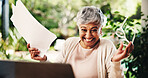 Paper, celebration and senior woman with financial success, mortgage approval or profit on laptop. Document, excited person and winning with retirement savings, debt free or lottery at home backyard