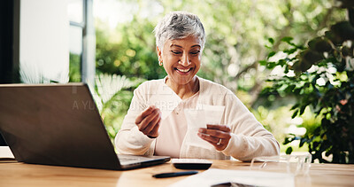 Buy stock photo Senior, happy woman or laptop with receipts for tax return, deduction or finance at home. Mature, female person and smile with payslips or invoices for financial profit, banking or salary at house