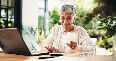 Buy stock photo Senior, happy woman or laptop with calculator or receipts for tax return or finance at home. Mature, female person and smile with payslip, invoices or bills for financial audit or accounting at house