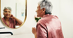 Senior woman, mirror or check for grooming in bathroom for natural beauty, wellness or results. Morning, mature or person with reflection in house for cosmetic benefits, growth inspection or skincare