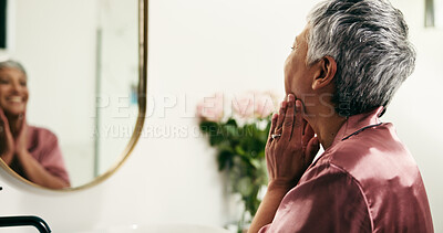 Buy stock photo Senior woman, mirror and skincare in bathroom to check results, facial glow and treatment. Elderly person, reflection and cosmetics for beauty, dermatology progress and hydration benefits at house